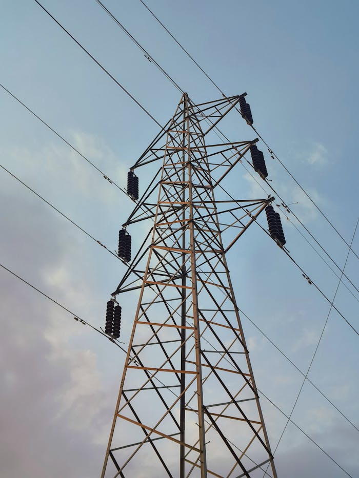 services-03 A modern high voltage transmission tower against a clear sky in Bhopal, India.